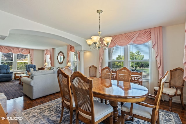 3555 Vista Blvd, Sparks, NV 89436 - dining area featuring a chandelier, dark wood-style flooring, and arched walkways