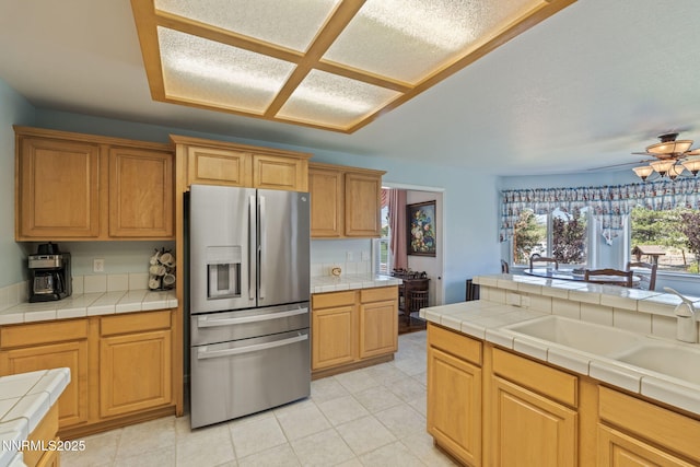 3555 Vista Blvd, Sparks, NV 89436 - kitchen featuring stainless steel fridge, ceiling fan, and tile countertops