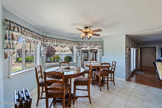 3555 Vista Blvd, Sparks, NV 89436 - dining room with healthy amount of natural light, ceiling fan, and light tile patterned flooring