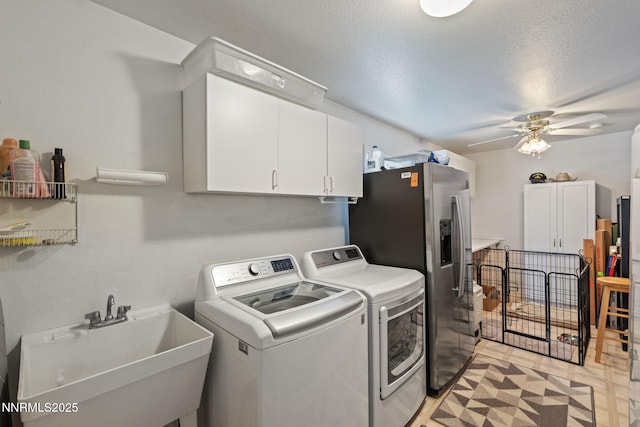3555 Vista Blvd, Sparks, NV 89436 - laundry area with cabinet space, washer and clothes dryer, and a ceiling fan