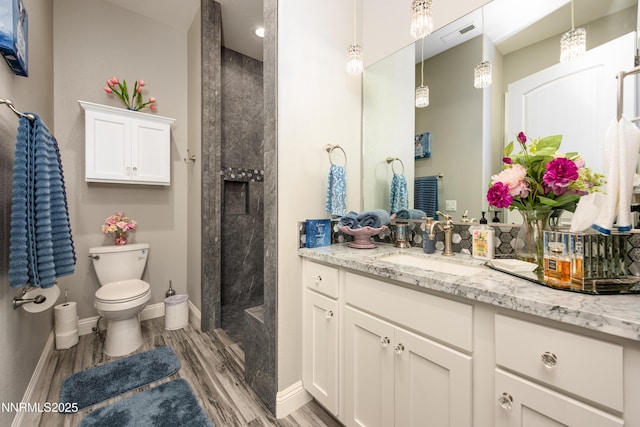 2092 Canterbury Ln, Carson City, NV 89703 - full bath with vanity, a tile shower, and wood finished floors