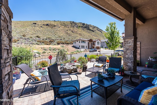 2092 Canterbury Ln, Carson City, NV 89703 - fenced backyard featuring a patio, a mountain view, and outdoor lounge area