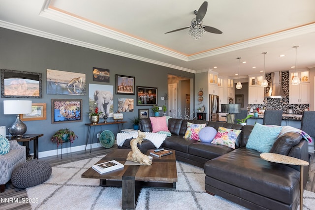 2092 Canterbury Ln, Carson City, NV 89703 - living area with a tray ceiling, a ceiling fan, ornamental molding, recessed lighting, and light wood-style flooring