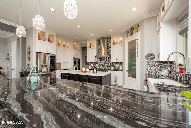 2092 Canterbury Ln, Carson City, NV 89703 - kitchen featuring stainless steel appliances, wall chimney exhaust hood, tasteful backsplash, recessed lighting, and a chandelier