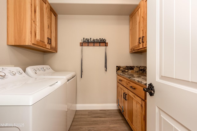 2092 Canterbury Ln, Carson City, NV 89703 - laundry area featuring independent washer and dryer, cabinet space, and wood finished floors