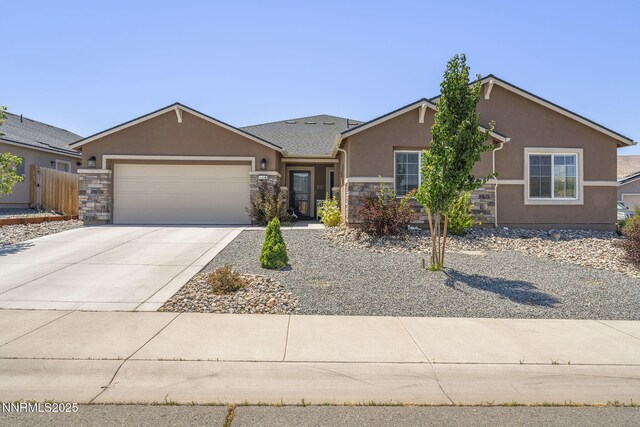6496 Arc Dome Dr, Carson City, NV 89701 - ranch-style home featuring stucco siding, stone siding, an attached garage, and driveway