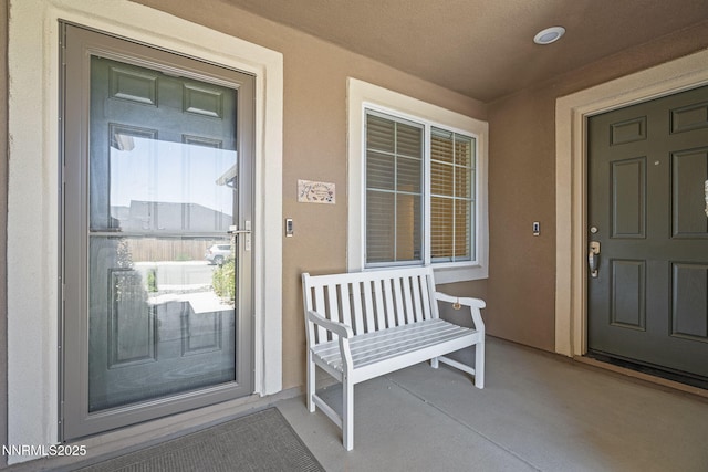6496 Arc Dome Dr, Carson City, NV 89701 - entrance to property featuring stucco siding and covered porch