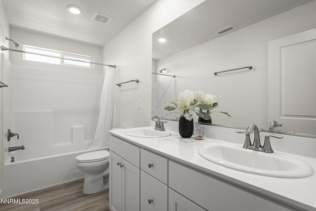 6496 Arc Dome Dr, Carson City, NV 89701 - bathroom featuring shower / bath combo with shower curtain, wood finished floors, and double vanity