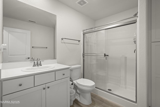 6496 Arc Dome Dr, Carson City, NV 89701 - bathroom featuring wood finished floors, a shower stall, and vanity
