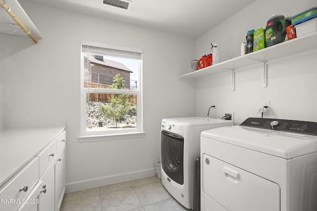 6496 Arc Dome Dr, Carson City, NV 89701 - laundry area with washing machine and clothes dryer, cabinet space, and light tile patterned flooring