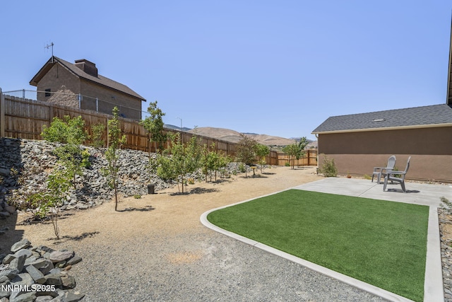 6496 Arc Dome Dr, Carson City, NV 89701 - fenced backyard featuring a patio