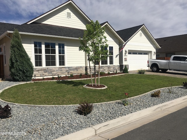 11720 Valley Crest Dr, Sparks, NV 89441 - view of front of house with an attached garage, stone siding, a front lawn, concrete driveway, and a shingled roof