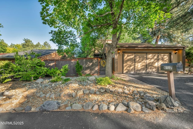 6437 Meadow Valley Ln, Reno, NV 89519 - view of front facade with asphalt driveway and an attached garage