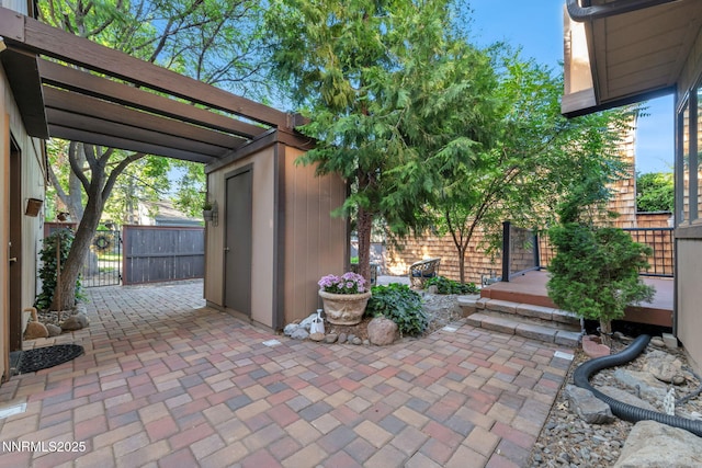 6437 Meadow Valley Ln, Reno, NV 89519 - view of patio / terrace with a storage shed and a gate