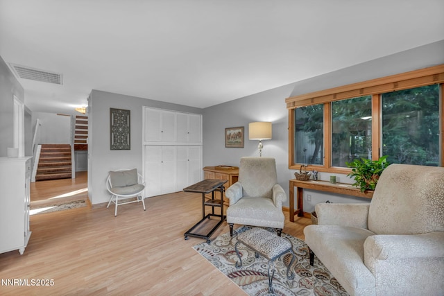 6437 Meadow Valley Ln, Reno, NV 89519 - living area featuring stairway and light wood finished floors