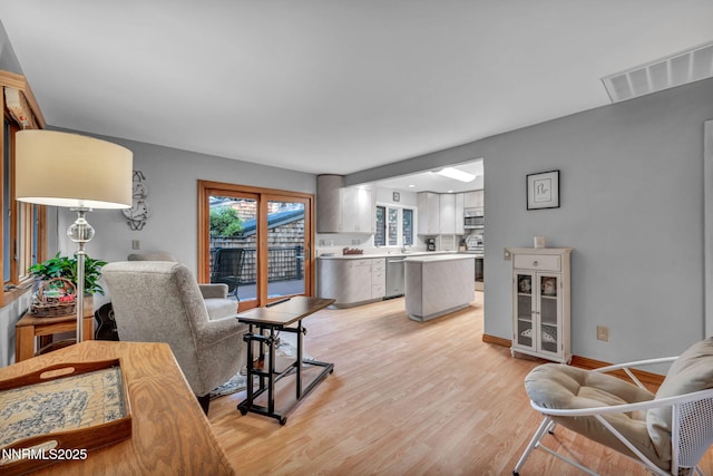 6437 Meadow Valley Ln, Reno, NV 89519 - living area featuring light wood-style floors and baseboards