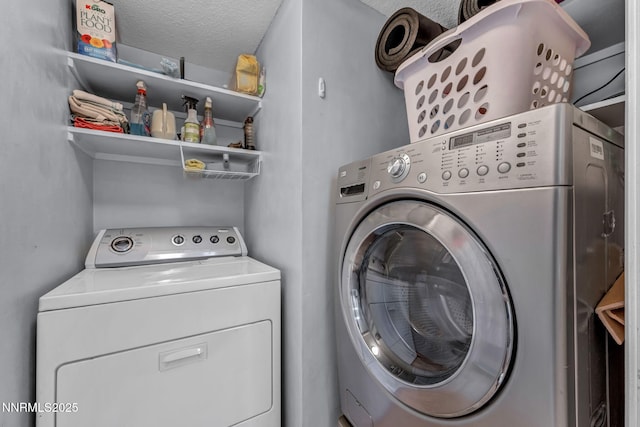 6437 Meadow Valley Ln, Reno, NV 89519 - washroom with washer and clothes dryer and a textured ceiling