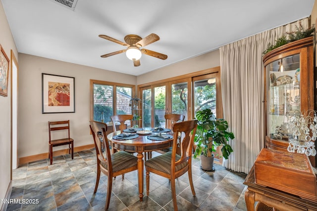 6437 Meadow Valley Ln, Reno, NV 89519 - dining area with ceiling fan and stone finish floors
