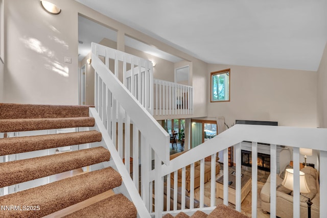 6437 Meadow Valley Ln, Reno, NV 89519 - staircase featuring lofted ceiling