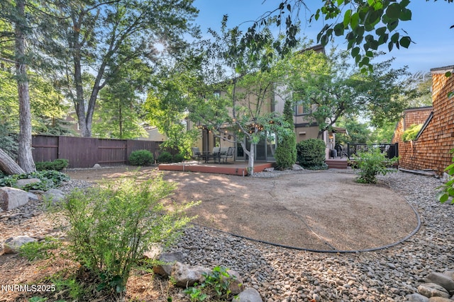 6437 Meadow Valley Ln, Reno, NV 89519 - fenced backyard with a patio and a wooden deck