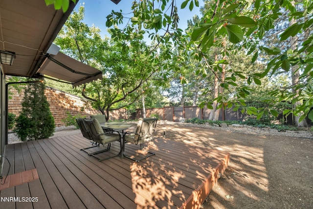 6437 Meadow Valley Ln, Reno, NV 89519 - wooden terrace featuring outdoor dining area and a fenced backyard