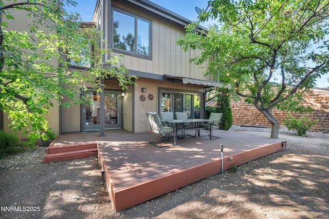 6437 Meadow Valley Ln, Reno, NV 89519 - back of property featuring a wooden deck and outdoor dining area