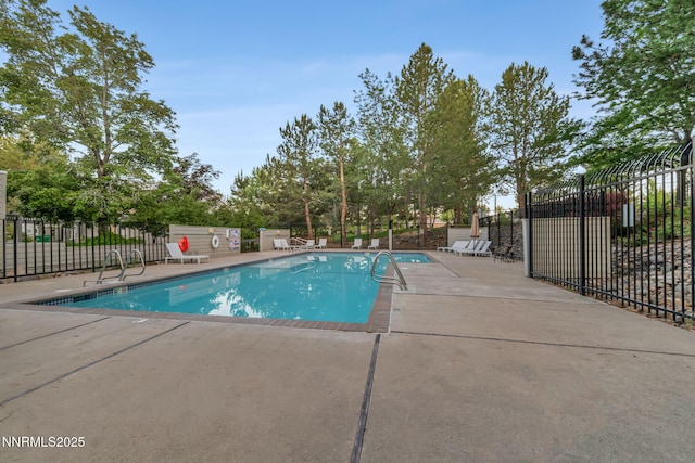 6437 Meadow Valley Ln, Reno, NV 89519 - community pool featuring a patio