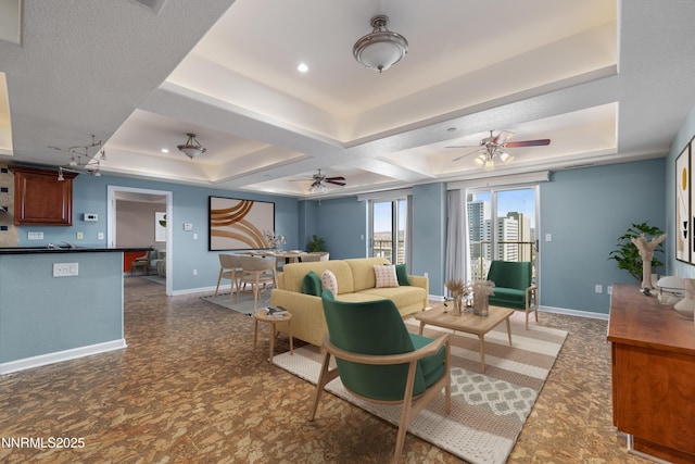200 W 2nd St Apt 1501, Reno, NV 89501 - living area with a tray ceiling and a ceiling fan