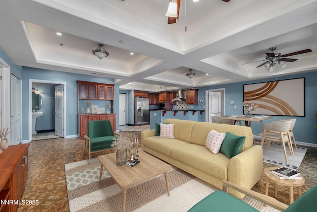 200 W 2nd St Apt 1501, Reno, NV 89501 - living area featuring a ceiling fan, a raised ceiling, coffered ceiling, and beam ceiling