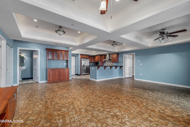 200 W 2nd St Apt 1501, Reno, NV 89501 - unfurnished living room featuring a ceiling fan, a tray ceiling, coffered ceiling, and beamed ceiling