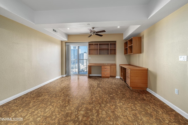 200 W 2nd St Apt 1501, Reno, NV 89501 - unfurnished living room featuring built in study area, a ceiling fan, and a textured wall