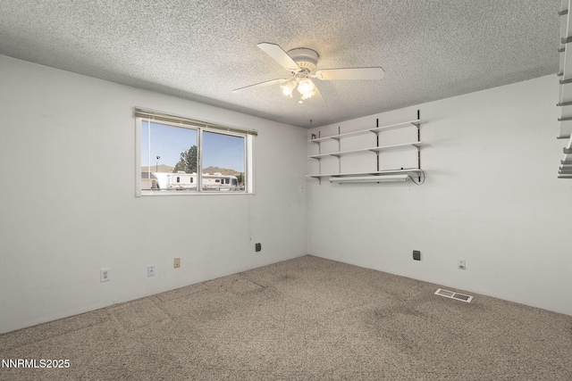 9100 Rain Dance Way, Reno, NV 89506 - unfurnished room featuring carpet flooring, a ceiling fan, and a textured ceiling