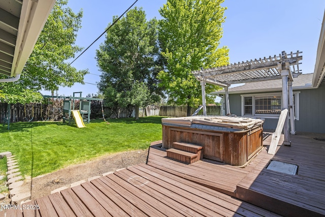 9100 Rain Dance Way, Reno, NV 89506 - wooden deck with a hot tub, a fenced backyard, a playground, and a pergola
