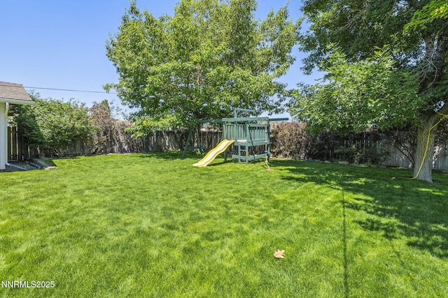 9100 Rain Dance Way, Reno, NV 89506 - fenced backyard featuring a playground