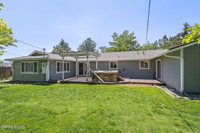 9100 Rain Dance Way, Reno, NV 89506 - back of property featuring a hot tub, a pergola, and a deck