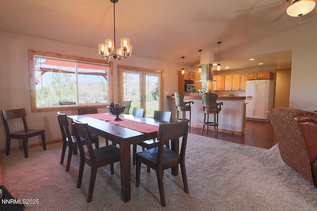 80 Bobcat Dr, Reno, NV 89523 - carpeted dining room featuring vaulted ceiling, healthy amount of natural light, a chandelier, and recessed lighting