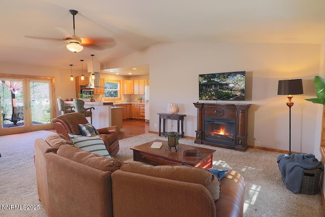 80 Bobcat Dr, Reno, NV 89523 - living area featuring light carpet, lofted ceiling, a glass covered fireplace, and ceiling fan