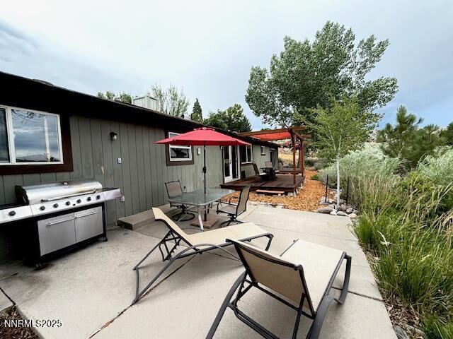 80 Bobcat Dr, Reno, NV 89523 - view of patio featuring outdoor dining area, a grill, and a pergola