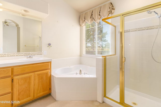 6993 Cinnamon Dr, Sparks, NV 89436 - bathroom with a shower stall, vanity, a bath, and ceiling fan
