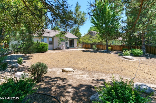 6993 Cinnamon Dr, Sparks, NV 89436 - view of yard featuring a patio area
