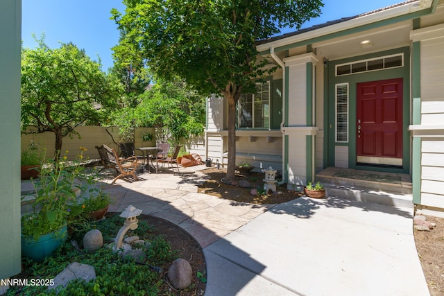 6993 Cinnamon Dr, Sparks, NV 89436 - doorway to property with outdoor dining space and a patio area