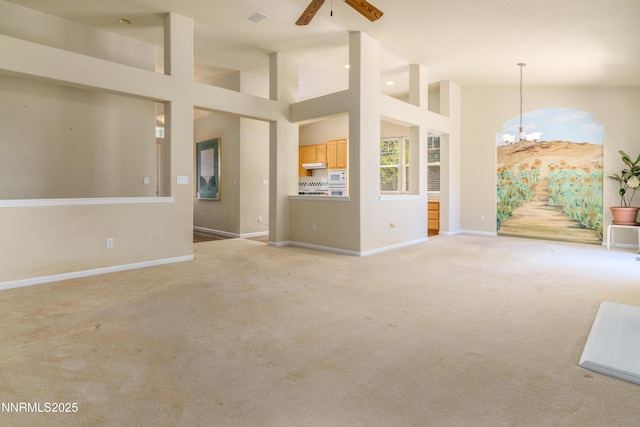 6993 Cinnamon Dr, Sparks, NV 89436 - unfurnished living room with a chandelier, light colored carpet, a ceiling fan, and high vaulted ceiling