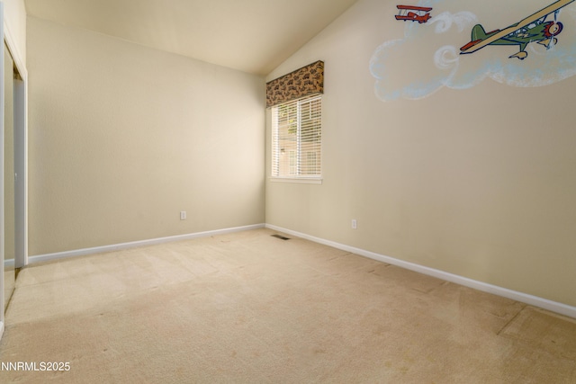 6993 Cinnamon Dr, Sparks, NV 89436 - carpeted empty room featuring vaulted ceiling and baseboards