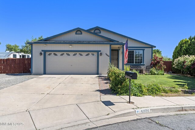 5886 Wishbone Ct, Sun Valley, NV 89433 - ranch-style home with concrete driveway and an attached garage