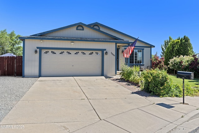 5886 Wishbone Ct, Sun Valley, NV 89433 - ranch-style house with driveway and a garage