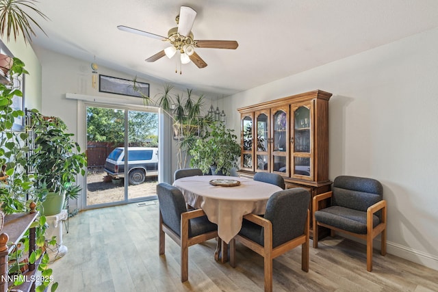 5886 Wishbone Ct, Sun Valley, NV 89433 - dining room with light wood-style floors, ceiling fan, and lofted ceiling