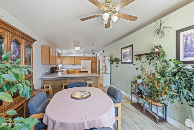 5886 Wishbone Ct, Sun Valley, NV 89433 - dining room featuring light wood-type flooring and ceiling fan