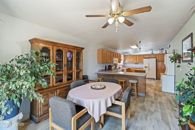 5886 Wishbone Ct, Sun Valley, NV 89433 - dining room with light wood-style floors, ceiling fan, and lofted ceiling