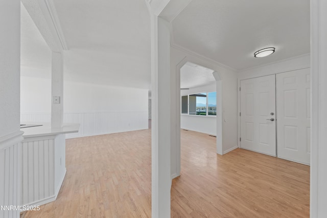 1314 Johnson Ln, Minden, NV 89423 - entryway featuring ornamental molding, arched walkways, and light wood-style floors