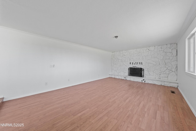 1314 Johnson Ln, Minden, NV 89423 - unfurnished living room featuring a fireplace and light wood-style floors